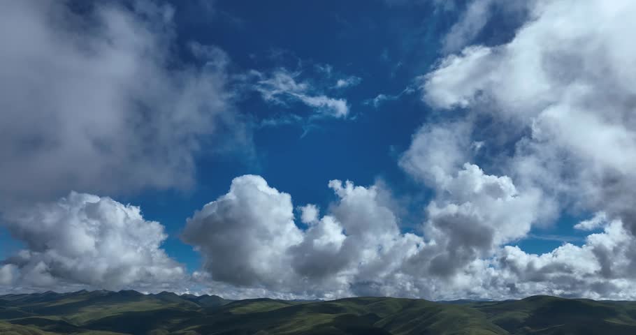 Beautiful green grassland and cloudy sky in Litang county, China