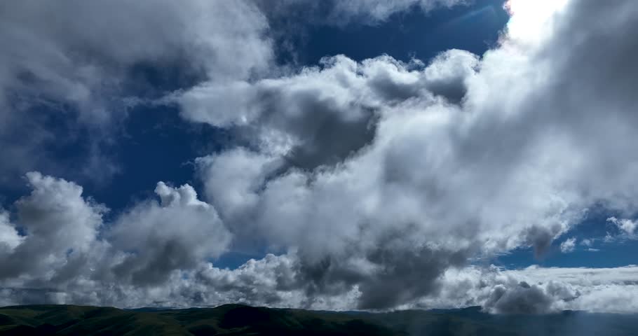 Beautiful green grassland and cloudy sky in Litang county, China
