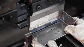 Sheet metal bending with hydraulic press. Close-up of a metalworker operating a hydraulic press brake machine to bend sheet metal into precise angles and shapes. - Powered by Shutterstock - Get 15% off with code: PIKWIZARD15
