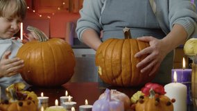 Children Carving Pumpkin Little Boy And Girl In Halloween Costumes Create A Jack-O'-Lantern With Their Loving Mother In A Cozy Kitchen, Full Of Joy, Light, And Playful Autumn Holiday Vibes. - Powered by Shutterstock - Get 15% off with code: PIKWIZARD15