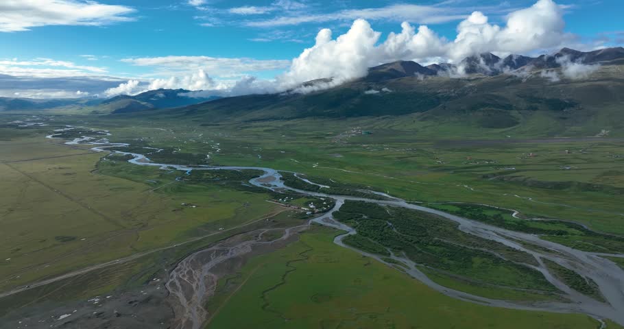 Beautiful green grassland and cloudy sky in Litang county, China