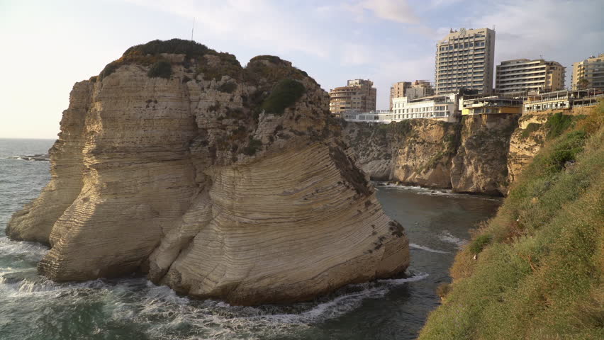 The Pigeon Rocks, a large stone formation an natural landmark of the city, located next to Mediterranean coast in Beirut, Lebanon