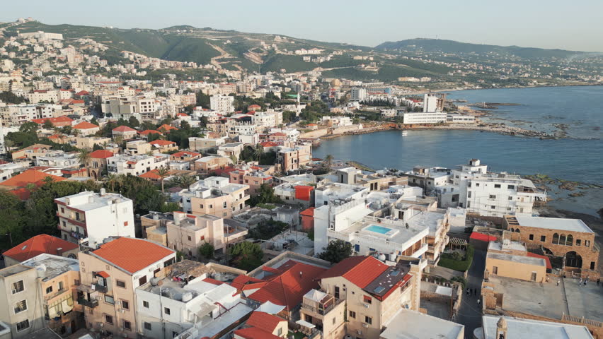 Aerial perspective of old town Batroun in Lebanon, Flying backwards, panoramic view.