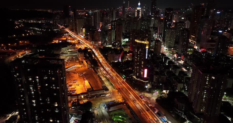 Shenzhen ,China - July 14, 2022: Aerial footage of night cityscape in downtown of shenzhen city, China