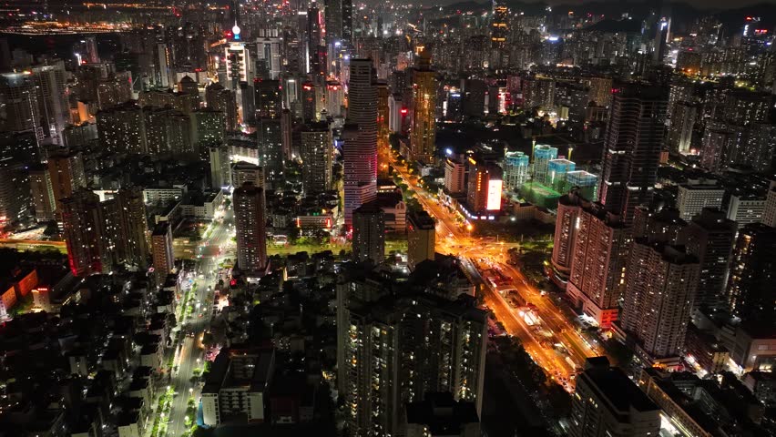 Shenzhen ,China - July 14, 2022: Aerial footage of night cityscape in downtown of shenzhen city, China