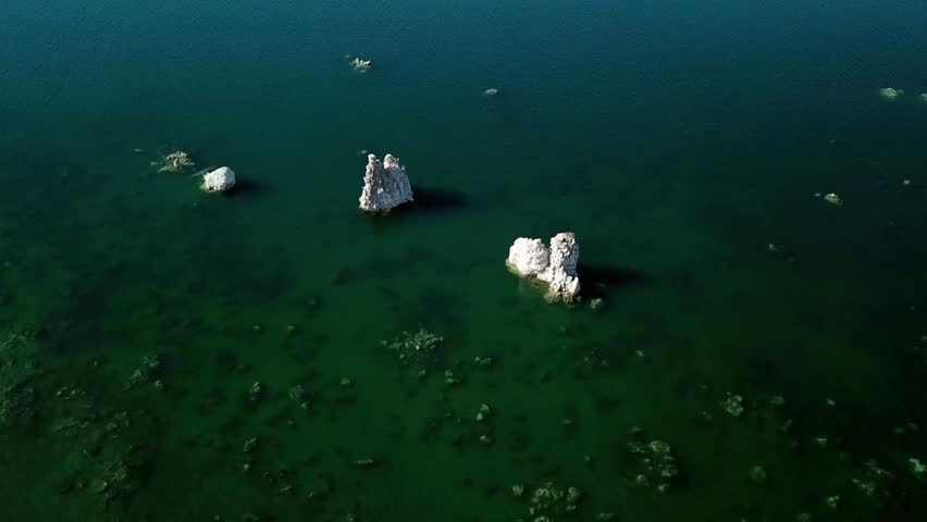 Aerial view of tufa towers rising from mono lakes turquoise waters in california