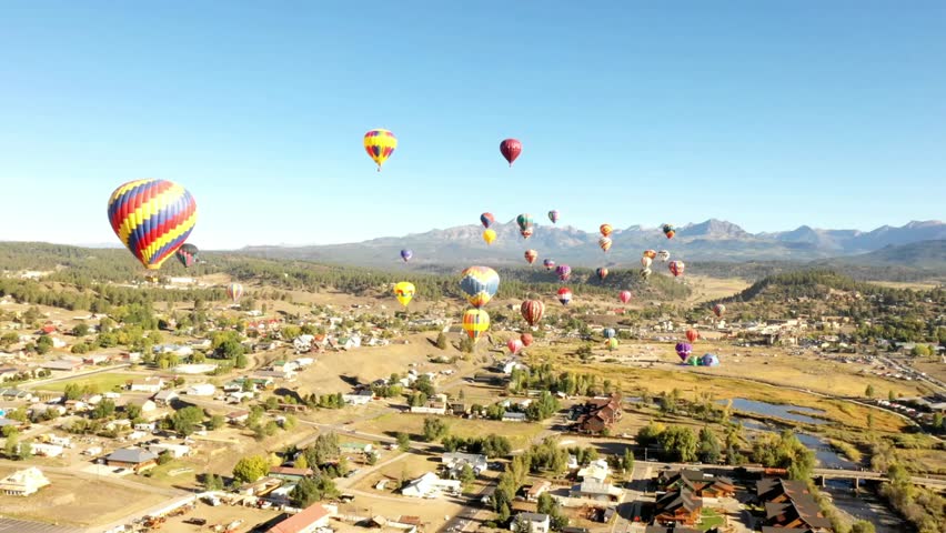 Hot air balloons floating over pagosa springs during a balloon festival