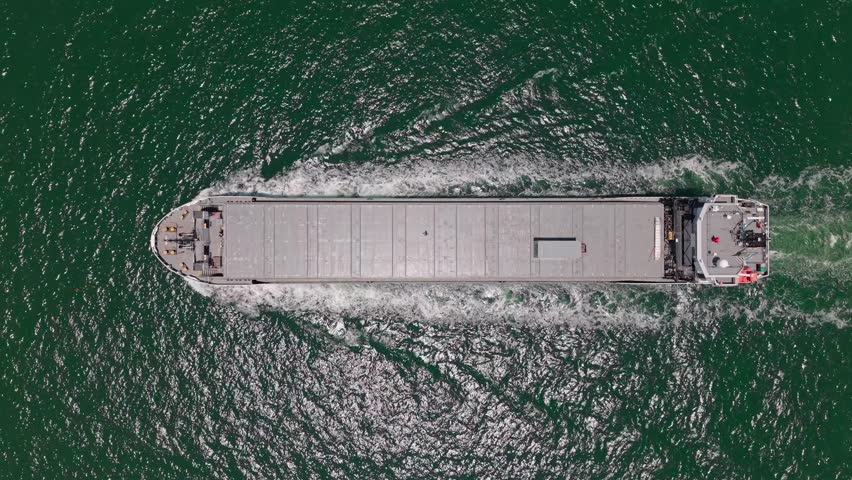 Container ship. Export and import. Cargo business. Empty barge. Cargo ship with container at sea, aerial view. Freight cargo vessel for container. Cargo ship vessel leaving port. Commercial transport