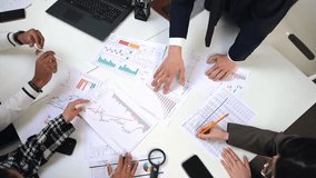 Business team pointing at documents and blueprints during meeting discussion. - Powered by Shutterstock - Get 15% off with code: PIKWIZARD15