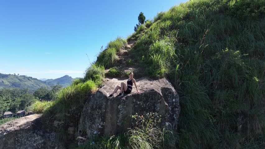 Aerial view of young lady on Ella Rock in Sri Lanka.