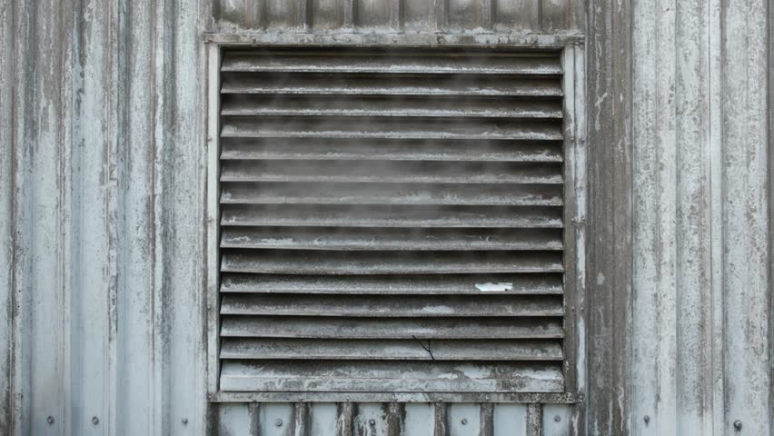 Looping Video Of Steam Exiting A Grungy Industrial Vent