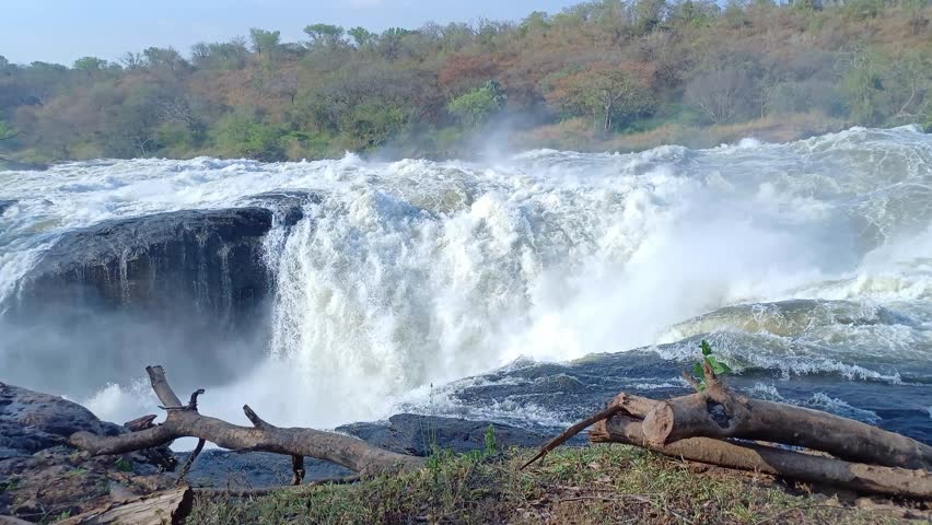 A ground-level view of Victoria Nile waters rushing through a narrow 5-meter gap at Murchison Falls, Uganda