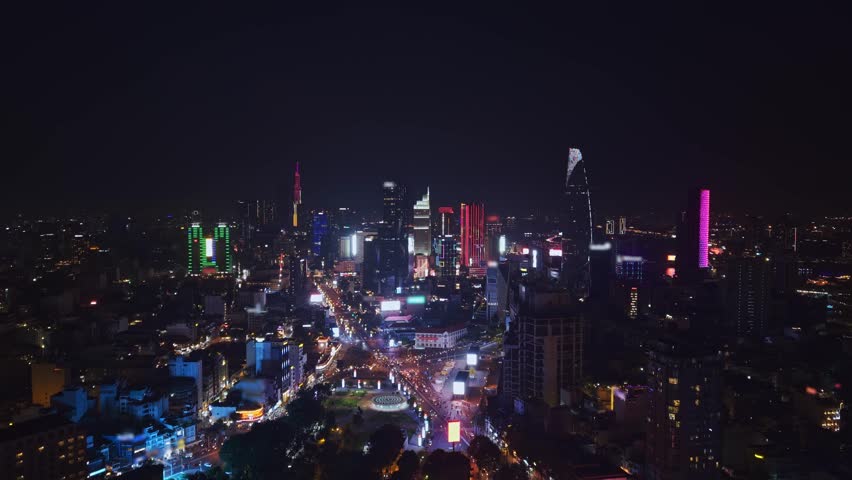 Aerial night view Ho chi minh city or Saigon in Vietnam, illuminated of business center with skyscrapers.