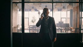 Angry investor quarrelling phone loudly feeling despair of money loss closeup. Silhouette senior nervous businessman finish cellphone call worried business problem. Furious ceo shouting in smartphone. - Powered by Shutterstock - Get 15% off with code: PIKWIZARD15