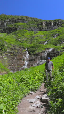 Explore the breathtaking landscapes of Glacier National Park in Montana, featuring lush greenery, waterfalls, and majestic mountains, ideal for outdoor enthusiasts and nature lovers