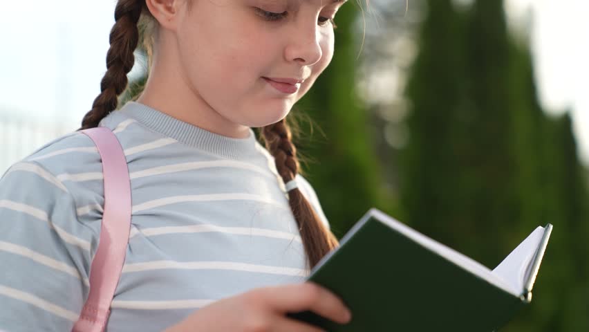 girl schoolgirl kid child reading book park, close-up face book, girl schoolgirl kid child reading interesting story school book, educational information young children, historical facts, girl
