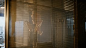 Businessman recording voice message on smartphone walking business hall in evening sunlight closeup. Aged manager creating audio email on cellphone by office glass wall. Bearded man boss talking phone - Powered by Shutterstock - Get 15% off with code: PIKWIZARD15