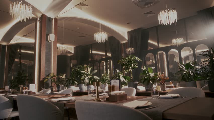Atmospheric tables in the cozy interior of the restaurant in the evening