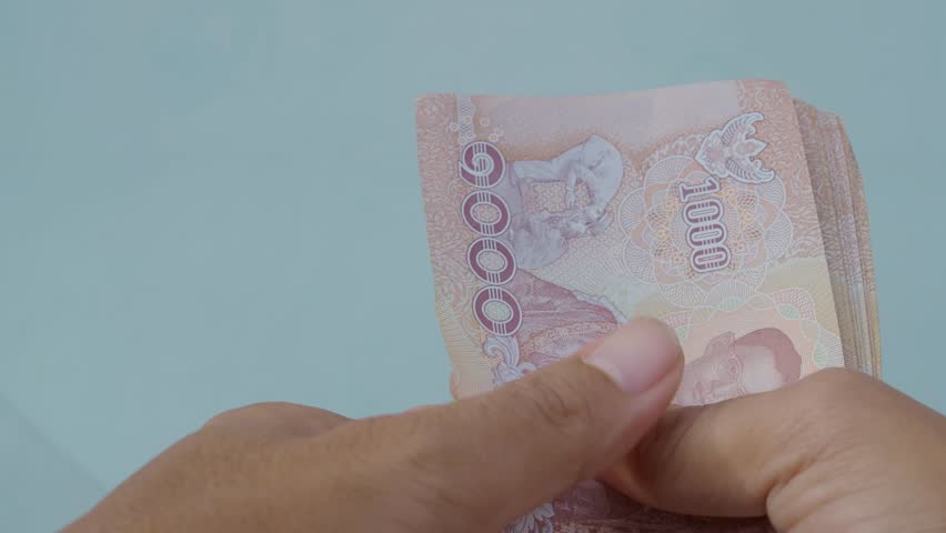 Woman  counting money cash 1000 baht of Thailand asian, count salary for savings investent financial income, concept business money  loan for house succeed.