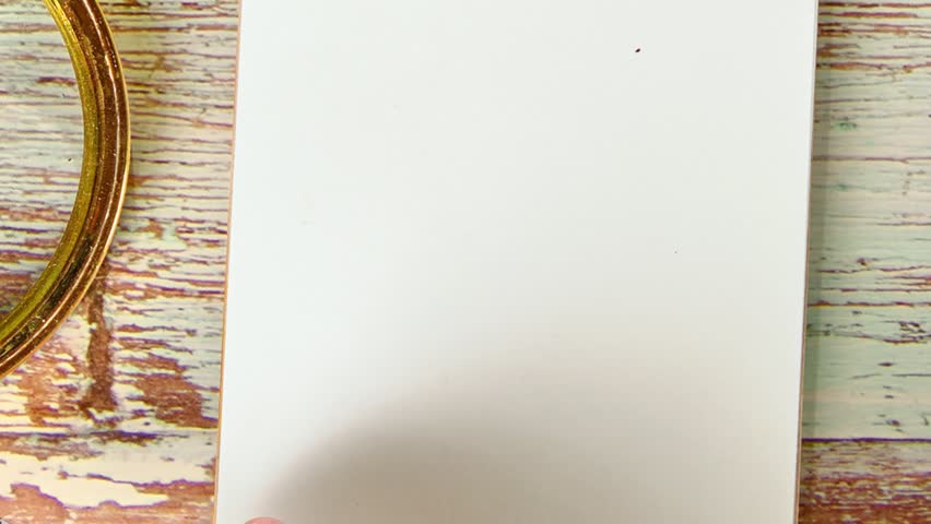 Animated text explains Reflective Practice in the notebook. Words appear and fade away. The animation presents the Business concept on a light brown wooden surface
