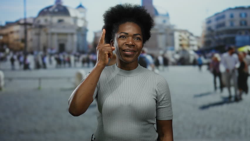 Young african-american woman gesturing idea in st. peter