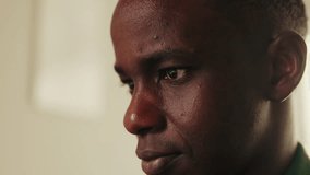 Close-up of serious Black man deep in thought. He is contemplative and focused, suggesting concentration or problem-solving. - Powered by Shutterstock - Get 15% off with code: PIKWIZARD15