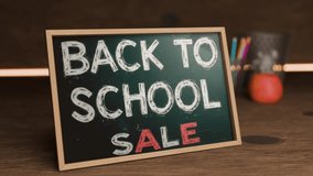 Back to School Sale Display With Chalkboard Sign, Vibrant Colors, and School Supplies in Background - Powered by Shutterstock - Get 15% off with code: PIKWIZARD15