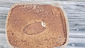 Tiramisu, an Italian dessert made of ladyfinger pastries (Savoiardi) dipped in coffee, layered with a whipped mixture of egg yolks, sugar, and mascarpone, and topped with cocoa powder - Powered by Shutterstock - Get 15% off with code: PIKWIZARD15
