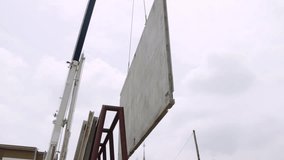 Cranes are used to lift and move precast concrete slabs slowly for house construction townhouse construction projects and to work safely during construction.
 - Powered by Shutterstock - Get 15% off with code: PIKWIZARD15