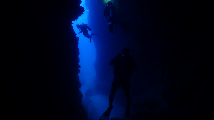scuba divers are exploring and enjoying the caves underwater cave dive