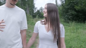 Young couple enjoying a peaceful day outdoors, bonding, talking, laughing, and playing guitar together in a natural, green park environment. - Powered by Shutterstock - Get 15% off with code: PIKWIZARD15