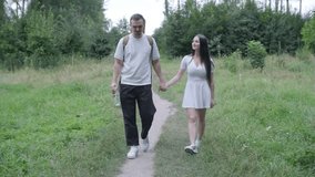 Young couple enjoying a peaceful day outdoors, bonding, talking, laughing, and playing guitar together in a natural, green park environment. - Powered by Shutterstock - Get 15% off with code: PIKWIZARD15
