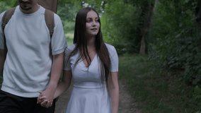 Young couple enjoying a peaceful day outdoors, bonding, talking, laughing, and playing guitar together in a natural, green park environment. - Powered by Shutterstock - Get 15% off with code: PIKWIZARD15