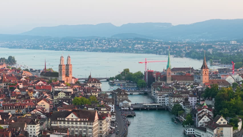 A Beautiful Aerial View of Zurich Cityscape at Dusk, showcasing architecture and city life. Switzerland