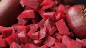 Cubes of sliced red raw beets falling on pile slow motion - Powered by Shutterstock - Get 15% off with code: PIKWIZARD15