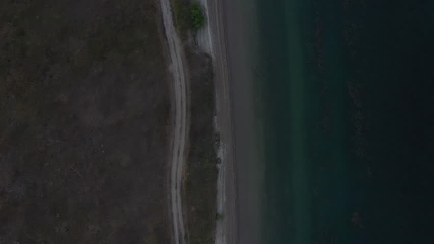Top-down drone view of Stanley Lake rippling water and shore