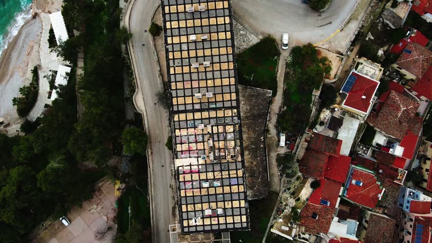 Aerial top down of urban abandoned building rooftops in city Nafplio in Mediterranean Greece Europe
