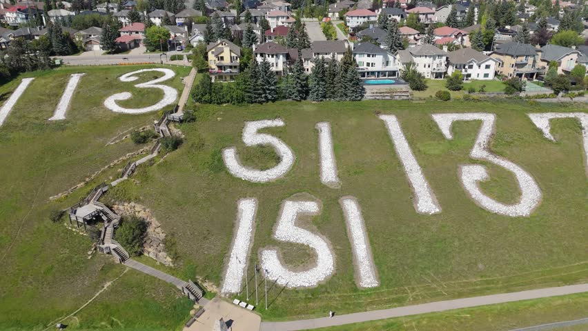 Aerial view of Battalion Park, in Signal Hill, built to commemorate WWI. It features historical stone formations, a pathway, and a lookout landing.