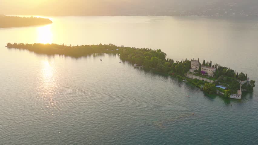 Aerial view of Isola del Garda, Lake Garda, Italy. Isola del Garda on Lake Garda features the historic Borghese Cavazza villa, lush botanical gardens, and stunning lake views.