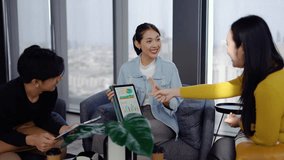 In a modern office, Asian businesswoman presents data summary charts on a tablet to her colleagues, financial report analysis teamwork strategy planning corporate success, marketing, data analytics - Powered by Shutterstock - Get 15% off with code: PIKWIZARD15