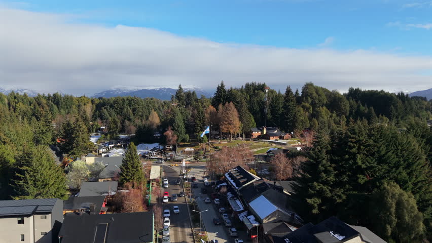 Aerial establishing fly Villa La Angostura, resort town on Nahuel Huapi Lake in Patagonia, Argentina, Daylight Panorama