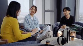 In a modern office, Asian businesswoman presents data summary charts on a tablet to her colleagues, financial report analysis teamwork strategy planning corporate success, marketing, data analytics - Powered by Shutterstock - Get 15% off with code: PIKWIZARD15