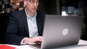 Business Man Talking On Video Conference Online In Office. Handsome Worker Having Video Call On Laptop Computer Indoor. Male Professional Explaining Project With Gestures At Remote Workplace - Powered by Shutterstock - Get 15% off with code: PIKWIZARD15