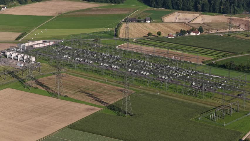 High voltage, power lines, electric grid installation infrastructure. Aerial drone video.