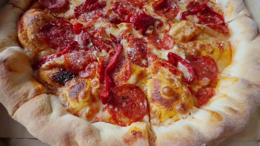 Delicious Pepperoni Pizza With Melted Mozzarella And Red Peppersю Freshly Baked Pizza, Hot And Cheesy, Appetizing Food. Takeout Meal Italian Cuisine. Lunch Or Dinner Fast Food, Comfort Food Pizza