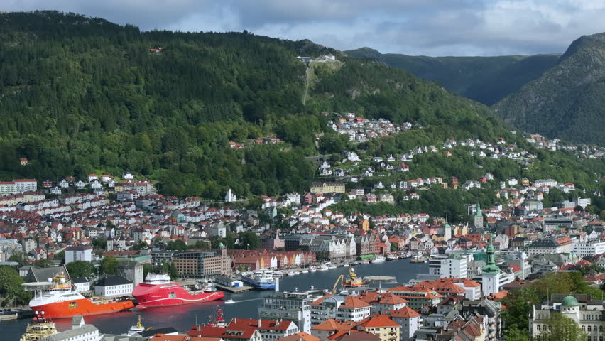 Aerial tracking shot moving sideways over Bergen’s harbor and historic Bryggen district
