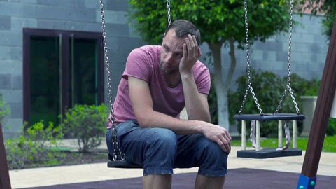 sad man sitting on swing slow Stock Footage Video (100% Royalty-free ...