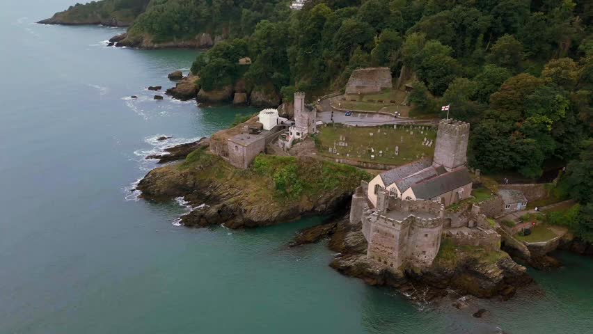 Daytime, aerial orbit around to rear of Dartmouth Castle looking back out to sea