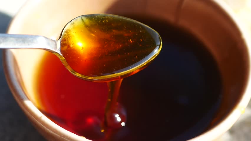 Homemade honey preparation in a rustic kitchen setting