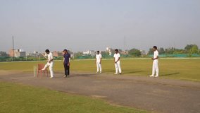 Cricket coach taking warm-up exercises of the team players before the match - Powered by Shutterstock - Get 15% off with code: PIKWIZARD15